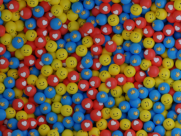 A collection of tokens displaying social media motifs such as thumbs up, smiley faces and hearts