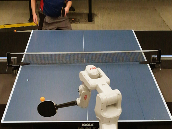 A robot playing table tennis with human partner