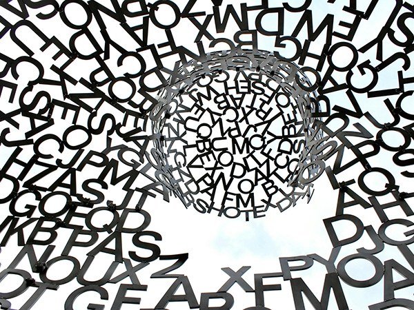 A conceptual graphic showing a jumble of letters spread out around a more concentrated ball of letters