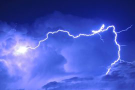 Lightning strike in a dark and cloudy sky