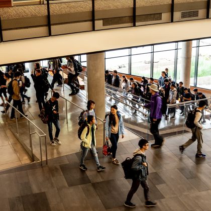 Students in between classes in Gates Center atrium.